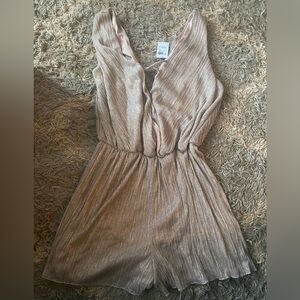 NWT Charlotte Russe Romper 
Size 1x
Beige/gold with metallic